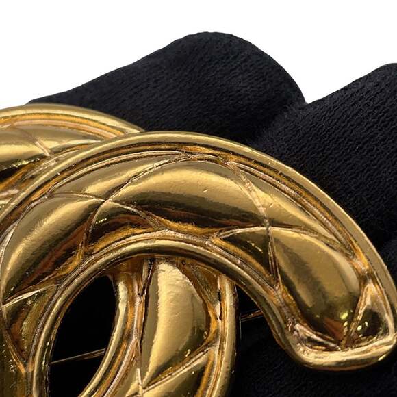 CHANEL Gold Logo Brooch